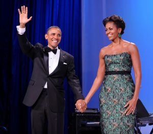 WASHINGTON, DC - SEPTEMBER 14: (AFP-OUT) U.S. President Barack Obama (L) and First Lady Michelle Obama wave during the Congressional Hispanic Caucus Institute's 34th Annual Awards Gala at the Washington Convention Center on September 14, 2011 in Washington, DC. Obama spoke about the $447 billion package of tax cuts as well as public spending and new jobs plan. (Photo by Olivier Douliery-Pool/Getty Images)